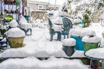 The back porch of a home in Burien, Washington is buried in snow.