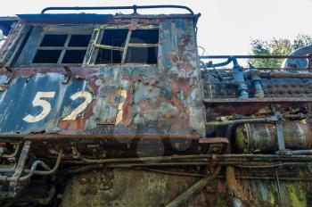 A closeup shot of an old derelict rail car.