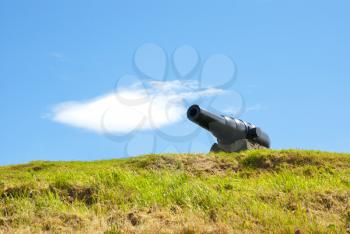 Old cannon on sky cloud