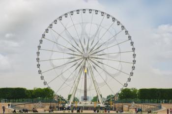 Landscape with a Ferris wheel   in the Tuileries garden in Paris. France