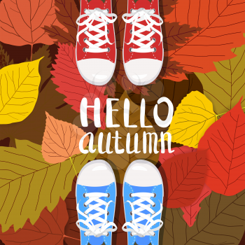 Hello autumn color illustration. Persons feet standing in sneakers on yellow, red, green fallen leaves. Hand drawn lettering.