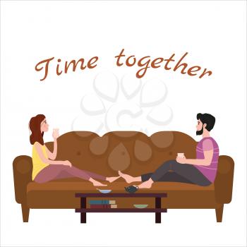 Cute loving couple on cozy sofa, drinking tea or drinks and eating together at home