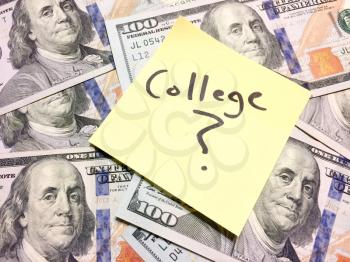 Post it note with hardwritten college with question mark on money with space for text on left side
