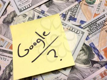 American cash money and yellow paper note with text Google with question mark in black color aerial view