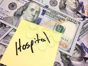 American cash money and yellow paper note with text Hospital in black color aerial view