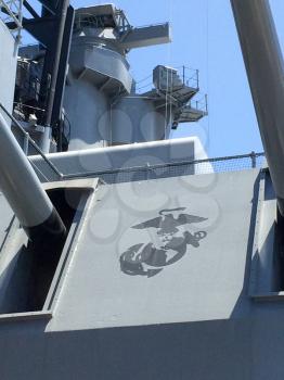 Long range navy guns and turret with US Marine Corps logo on USS Iowa naval warship destroyer battleship