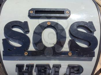 SOS save our ship sign money donation collection box on USS Iowa naval warship destroyer battleship