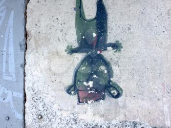 Urban street art graffiti small man figure green black