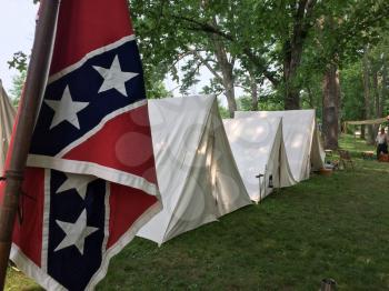 american civil war reenactment confederate flag in camp