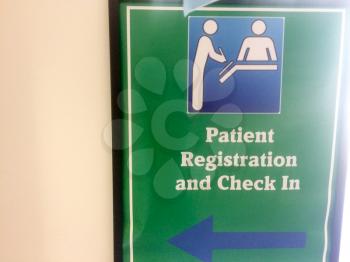Patient registration hospital sign at clinic with pictogram to check in