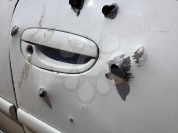 Automobile shot up bullet gun fire fight holes