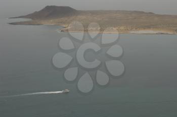 Ship sailing next to La Graciosa Island. Haria. Lanzarote. Canary Islands. Spain.