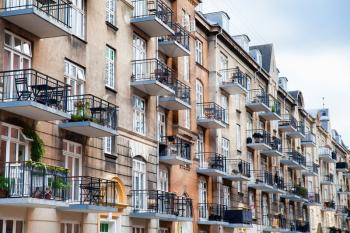 Copenhagen, Denmark - 12 September 2019: Balconies of a modern residential building with diminishing perspective, modern living standards