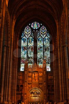 Liverpool, UK - 19 October 2019: Interior of Cathedral Church of Christ showing altar and stained glass window