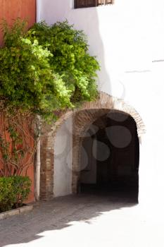 Seville, Spain - 29 July 2013: Arch in juderia, jewish neighborhood