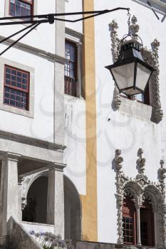 Palacio Nacional de Sintra exterior close-up with windows, doors and a lantern