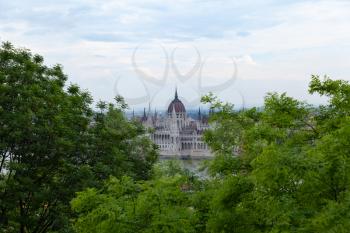 Budapest, Hungary - 7 May 2017: Hungarian Parliament framed by trees