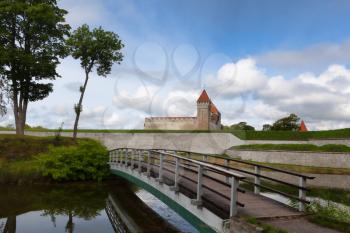Kuressaare, Saaremaa, Estonia - 09 August 2019: Kuressaare Episcopal Castle and the bridge across the moat
