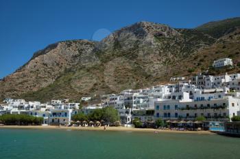Beautiful morning of Kamares village with turquoise water, white houses and mountain in Sifnos In Greece
