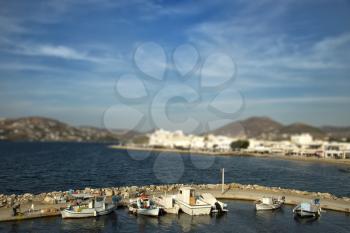 Fishing boats at the marina with tilt shift effect in Paros, Greece