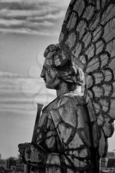 MONTREAL, CANADA-AUGUST 20th, 2014: Profile of an angel statue on the top of the chapel Notre-Dame-Du-Bon-secours in black and white in Montreal, Canada