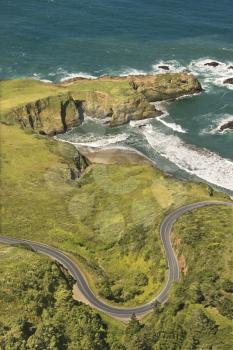Royalty Free Photo of an Aerial of winding road Shoreline Highway on west coast with Pacific Ocean in California, USA