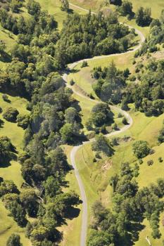 Aerial of road curving through rural landscape, USA.