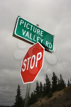 Royalty Free Photo of a Stop Sign and Road Sign Reading Picture Valley Rd
