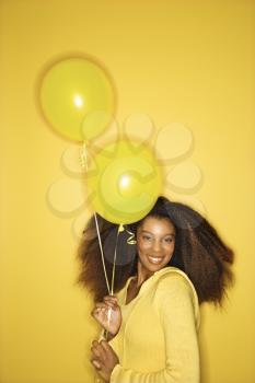Royalty Free Photo of a Woman Holding Balloons