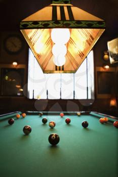 Royalty Free Photo of a Green Billiards Table With Pool Balls Spread Out