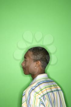 Royalty Free Photo of a Teen Boy Against a Green Background