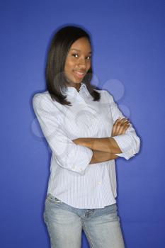 Royalty Free Photo of a Teen Girl Smiling With Crossed Arms