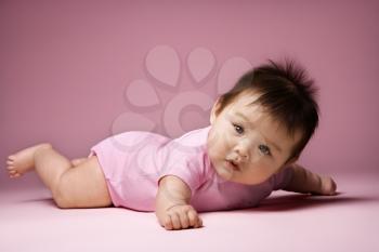 Royalty Free Photo of a Baby Lying on Her Stomach