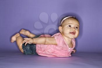 Royalty Free Photo of a Baby Lying on Her Stomach