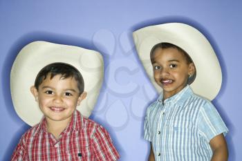 Royalty Free Photo of Children in Cowboy Hats