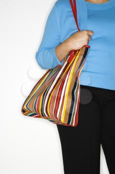 Royalty Free Photo of a Woman Holding a Purse