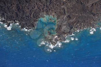 Royalty Free Photo of an Aerial of the Pacific Ocean and Maui, Hawaii Coast With Lava Rocks