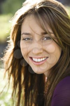 Royalty Free Photo of a Woman With Long Brown Hair Smiling