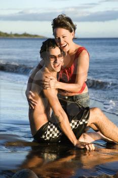 Royalty Free Photo of a Couple Frolicking on the Beach