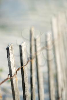 Royalty Free Photo of a Weathered Wooden Fence on a Beach in Bald Head Island, North Carolina