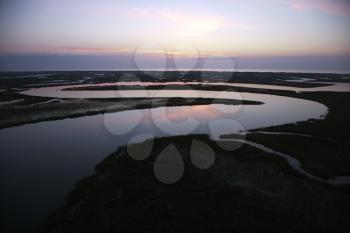 Royalty Free Photo of a Tidal Creek Meandering Through Wetlands of Bald Head Island, North Carolina