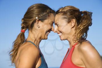 Royalty Free Photo of Women With Heads Together Smiling