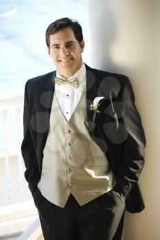 Royalty Free Photo of a Groom in a Tuxedo Smiling