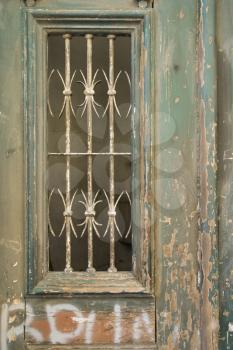 Royalty Free Photo of a Close-Up of Ornate Door With Peeling Paint and Graffiti in Lisbon, Portugal