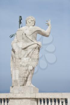 Royalty Free Photo of a Roman statue with blue sky in Rome, Italy