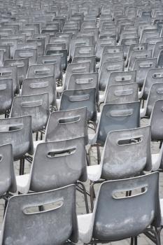 Close-up shot of several chairs in Saint Peter's Square in Vatican City, Italy.