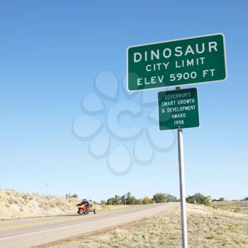 Royalty Free Photo of a City Limit Sign for the City of Dinosaur, Colorado, USA