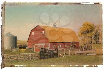 Polaroid transfer of red barn and fence in field.
