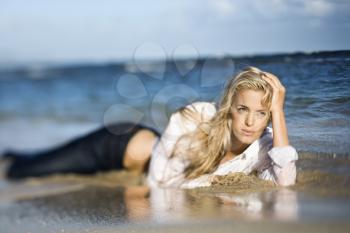 Royalty Free Photo of a Blond Woman Lying on Her Stomach on a Maui, Hawaii Beach