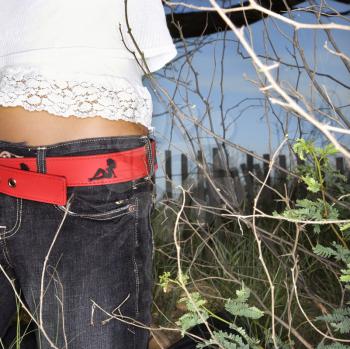 Royalty Free Photo of a Woman's Torso With a Red Belt